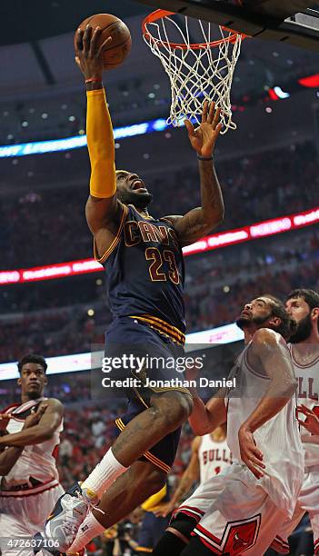 LeBron James of the Cleveland Cavaliers goes up for a shot over Joakim Noah of the Chicago Bulls in Game Three of the Eastern Conference Semifinals...