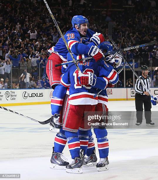 The New York Rangers celebrate their 2-1 overtime victory over the Washington Capitals in Game Five of the Eastern Conference Semifinals during the...