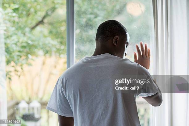 back of upset african american man looking down - african american man depressed bildbanksfoton och bilder