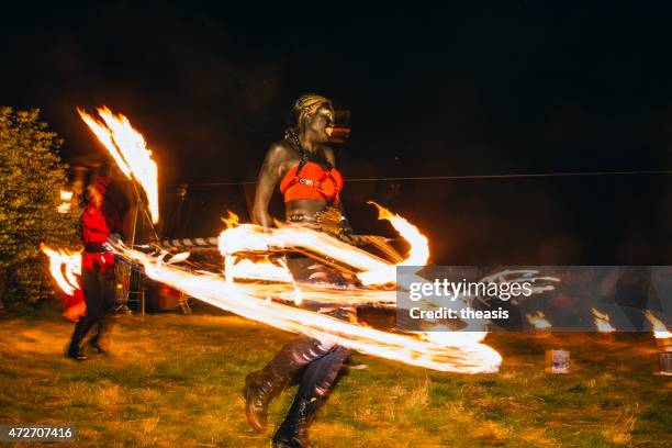 fire dancers at the beltane fire festival, edinburgh - beltane stockfoto's en -beelden