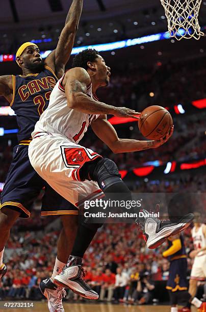 Derrick Rose of the Chicago Bulls drives past LeBron James of the Cleveland Cavaliers in Game Three of the Eastern Conference Semifinals of the 2015...