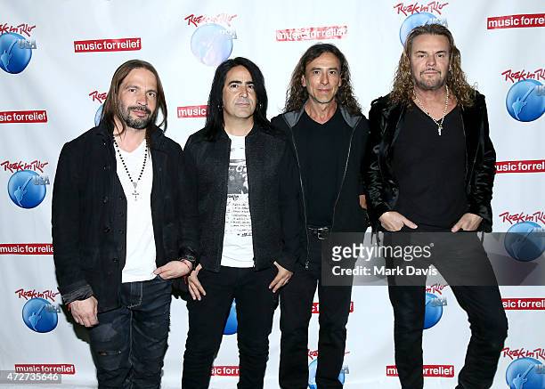 Musicians Sergio Vallin, Alex Gonzalez, Juan Calleros, and Fher Olvera of Mana pose backstage during Rock in Rio USA at the MGM Resorts Festival...