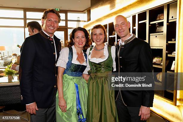 Axel Ludwig and his wife and Werner Mueller and his wife Nadine during the Kempinski Hotel Berchtesgaden opening party on May 8, 2015 in...
