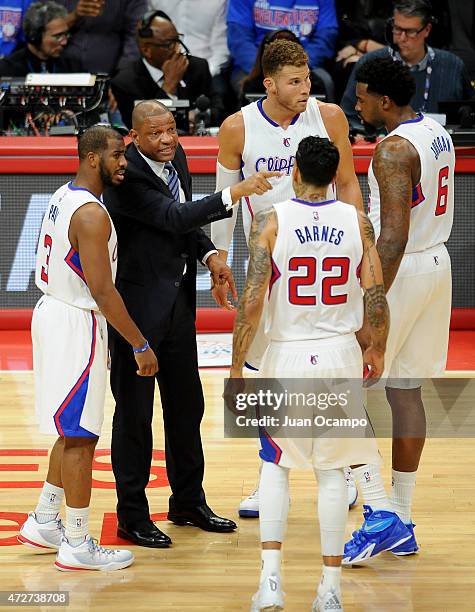 Los Angeles Clippers head coach Doc Rivers talks with his players, Chris Paul, Blake Griffin, Matt Barnes and DeAndre Jordan during the game against...