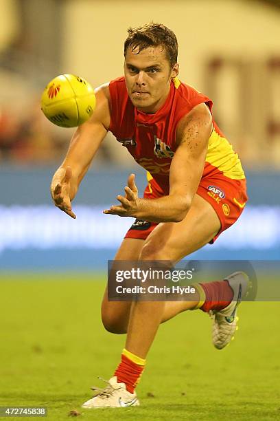 Kade Kolodjashnij of the Suns catches the ball during the round six AFL match between the Gold Coast Suns and the Adelaide Crows at Metricon Stadium...