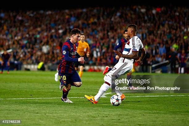 Lionel Messi of Barcelona passes by Jerome Boateng of Bayern to score his second goal during the first leg of UEFA Champions League semifinal match...