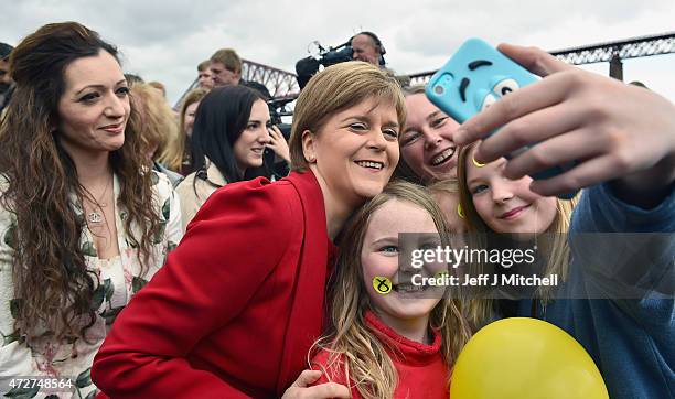 First Minister and leader of the SNP Nicola Sturgeon is joined by the newly elected members of parliament as they gather in front of the Forth Rail...