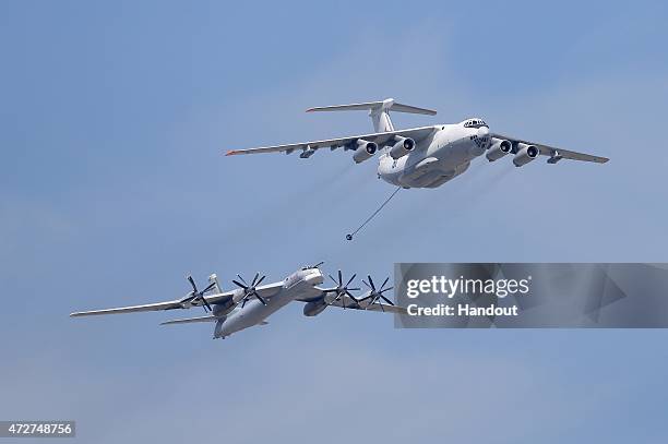 In this handout image supplied by Host photo agency / RIA Novosti, An Ilyushin Il-78 Midas air force tanker and a Tupolev Tu-95MS Bear strategic...