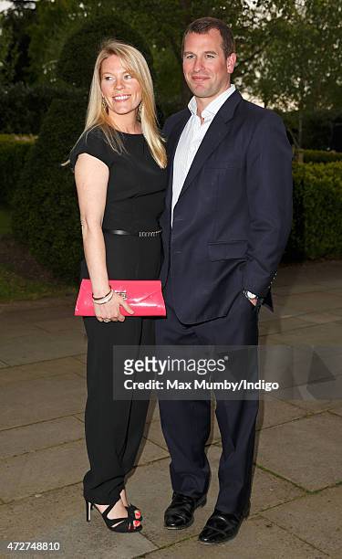 Peter Phillips and Autumn Phillips attend an evening reception for the ISPS Handa Mike Tindall 3rd Annual Celebrity Golf Classic at the Grove Hotel...