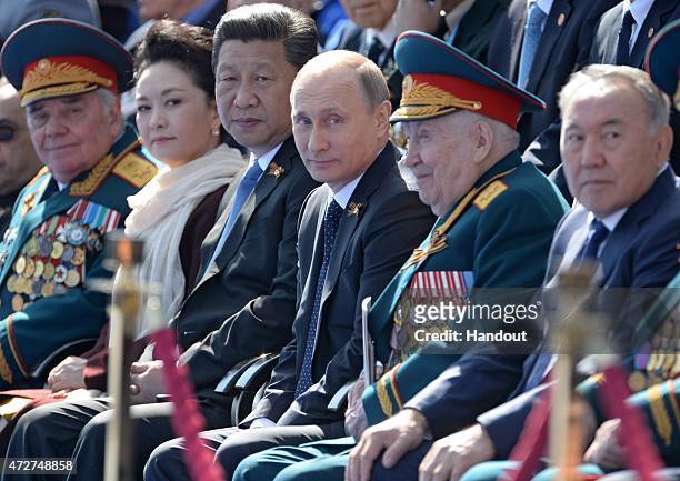 In this handout image supplied by Host photo agency / RIA Novosti, Russian President Vladimir Putin and President of the People's Republic of China...