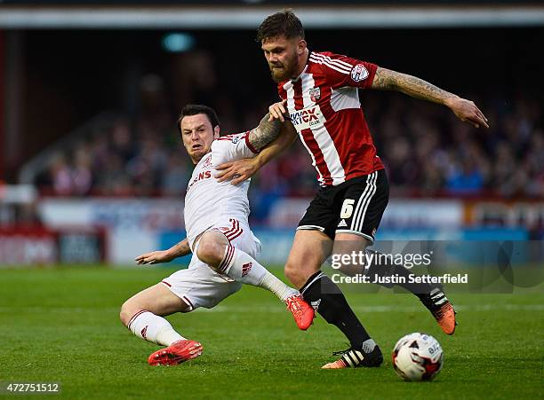 Harlee Dean of Brentford and Lee Tomlin of Middlesbrough During the Sky Bet Championship Playoff Semi-Final at Griffin Park between Brentford and...