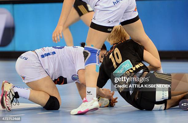 Norway's Gro Hammerseng-Edin fights for the ball with Russian Asma El Ghaoui during the EHF Women's Champions League Final Four semi-final match of...