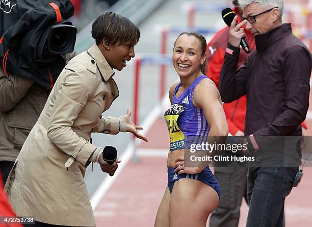 Jessica Ennis-Hill of Great Britain is interviewd for television by Denise Lewis after competing in the Women's 100 metres hurdles during the Great...