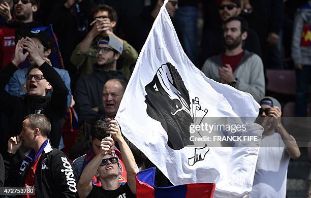 Gazelec Ajaccio's supporter waves a Corsican flag during the French L2 football match between Creteil Lusitanos vs Gazelec Ajaccio on May 9, 2015 at...