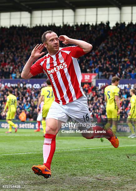 Charlie Adam of Stoke City celebrates scoring the opening goal during the Barclays Premier League match between Stoke City and Tottenham Hotspur at...
