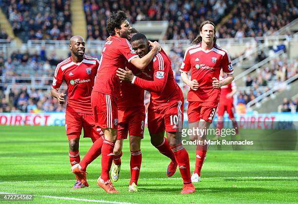 Victor Anichebe of West Brom celebrates scoring the opening goal with team mates during the Barclays Premier League match between Newcastle United...