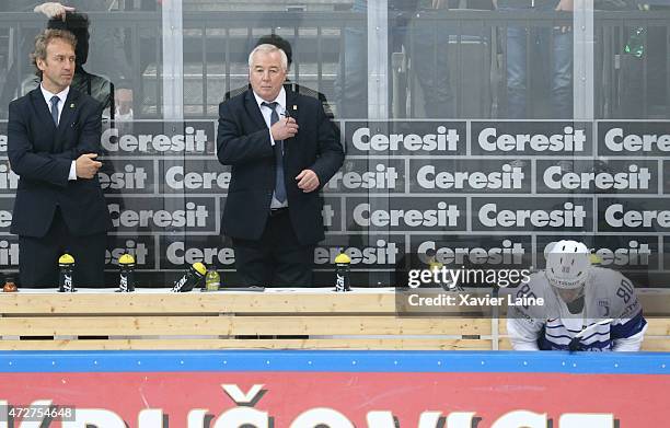 Assistant coach Pierre Pousse, head coach Dave Henderson and Teddy Da Costa of France are dispointed after defeact during the 2015 IIHF World...