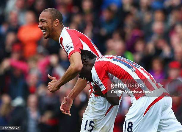 Steven N'Zonzi of Stoke City celebrates scoring his team's second goal with Mame Biram Diouf during the Barclays Premier League match between Stoke...