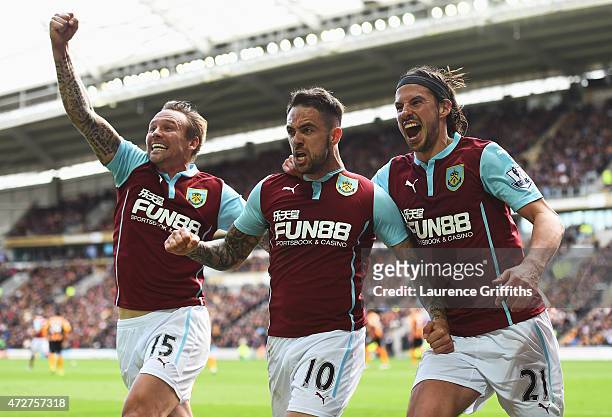 Danny Ings of Burnley celebrates scoring the opening goal with Matthew Taylor and George Boyd of Burnley during the Barclays Premier League match...
