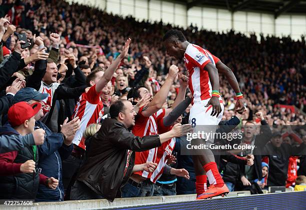 Mame Biram Diouf of Stoke City celebrates his team's third goal with fans during the Barclays Premier League match between Stoke City and Tottenham...