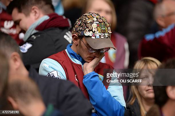 Burnley fan reacts after the final whistle during the English Premier League football match between Hull City and Burnley at the KC Stadium in...