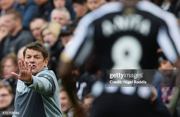 John Carver manager of Newcastle United signals during the Barclays Premier League match between Newcastle United and West Bromwich Albion at St...