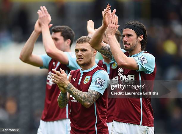 George Boyd and Kieran Trippier of Burnley applaud the fans after their team was relegated after the Barclays Premier League match between Hull City...