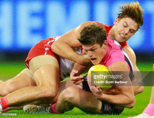 Angus Brayshaw of the Demons is tackled during the round six AFL match between the Melbourne Demons and the Sydney Swans at Melbourne Cricket Ground...