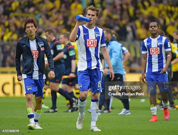 Sebastian Langkamp of Hertha BSC drinks water during the game between Borussia Dortmund and Hertha BSC on May 9, 2015 in Dortmund, Germany.