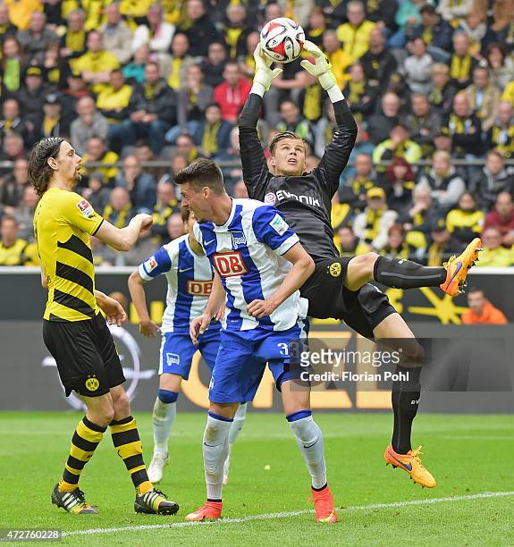 Mitchell Langerak of Borussia Dortmund jumps to save goal the ball against Sandro Wagner of Hertha BSC during the game between Borussia Dortmund and...