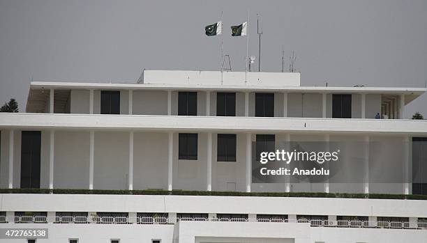 Pakistani flag flies half-mast at the building of National Assembly , in Islamabad, Pakistan, on May 9, 2015. Pakistan declared a day of mourning and...