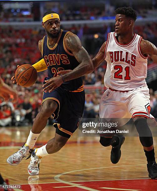 LeBron James of the Cleveland Cavaliers moves against Jimmy Butler of the Chicago Bulls in Game Three of the Eastern Conference Semifinals of the...