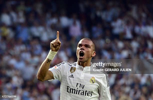 Real Madrid's Portuguese defender Pepe celebrates after scoring during the Spanish league football match Real Madrid CF vs Valencia CF at the...