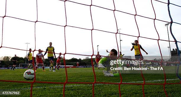 Emma Byrne of Arsenal fails to stop the shot of Nicola Watts of Bristol during the WSL match between Bristol Academy Women and Arsenal Ladies FC at...
