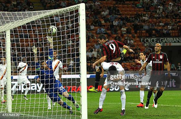 Mattia Destro of AC Milan scores a goal during the Serie a match between AC Milan and AS Roma at Stadio Giuseppe Meazza on May 9, 2015 in Milan,...
