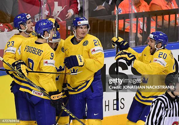 Forward Filip Forsberg of Sweden celebrates with his teammates after scoring the game winning goal at overtime during the group A preliminary round...