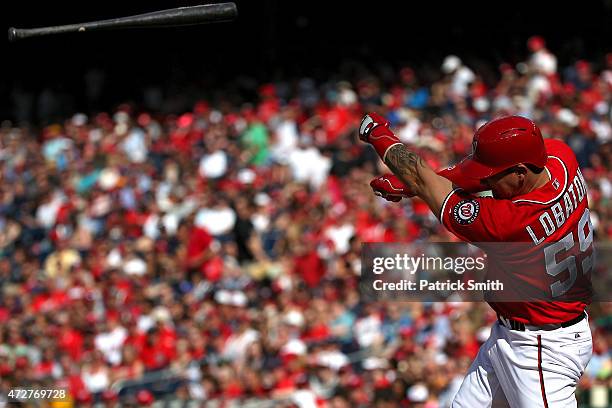 Jose Lobaton of the Washington Nationals loses his bat in the third inning against the Atlanta Braves at Nationals Park on May 9, 2015 in Washington,...