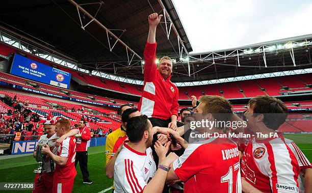 Graham Fenton, Manager of North Shields is held aloft by his players following their win during the FA Vase Final match between North Shields and...