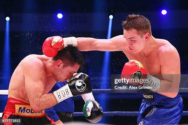 Fedor Chudinov of Russia delivers a punch to Felix Sturm of Germany during their WBA super middle weight World Championship fight at Festhalle on May...