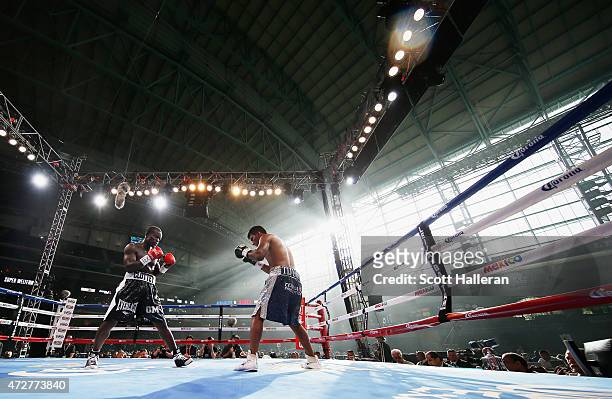 Joshua Clottey of Ghana and Jorge Silva of Mexico box in the fourth round during their super welterweight bout at Minute Maid Park on May 9, 2015 in...