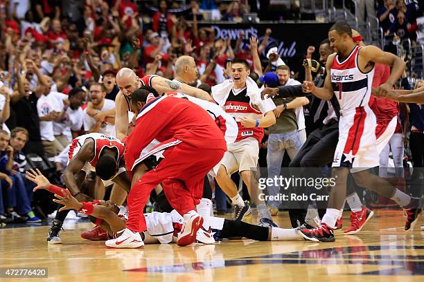 Paul Pierce of the Washington Wizards is mobbed by teammates after hitting the game winning shot to give the Wizards a 103-101 win over Atlanta Hawks...