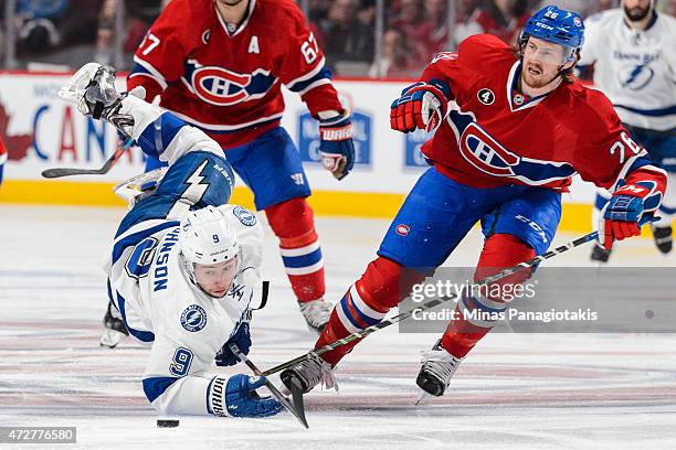 Jeff Petry of the Montreal Canadiens trips Tyler Johnson of the Tampa Bay Lightning in Game Five of the Eastern Conference Semifinals during the 2015...