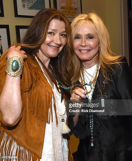 Singer/Songwriter Matraca Berg and Singer/Songwriter Kim Carnes backstage during 'Conversation And Performance: Kim Carnes' at The Country Music Hall...