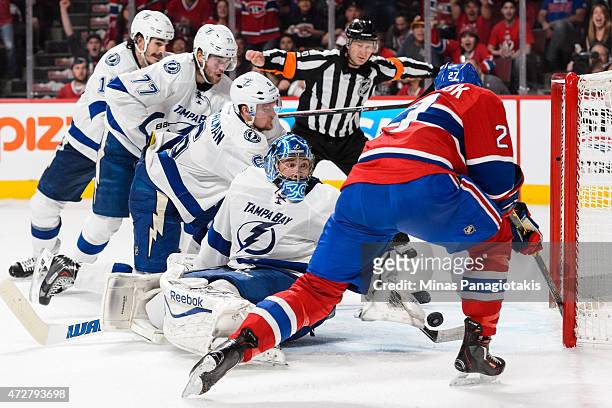 Alex Galchenyuk of the Montreal Canadiens tries to get the puck past goaltender Ben Bishop of the Tampa Bay Lightning in Game Five of the Eastern...