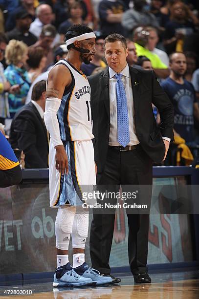 Head Coach David Joerger of the Memphis Grizzlies talks to Mike Conley of against the Golden State Warriors in Game Three of the Western Conference...