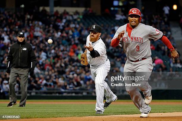 Adam LaRoche of the Chicago White Sox throws the ball to Emilio Bonifacio to force out Marlon Byrd of the Cincinnati Reds during the first inning in...