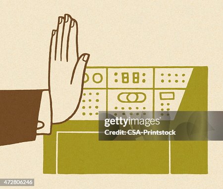 Hand by a Control Panel Hand by a Control Panel