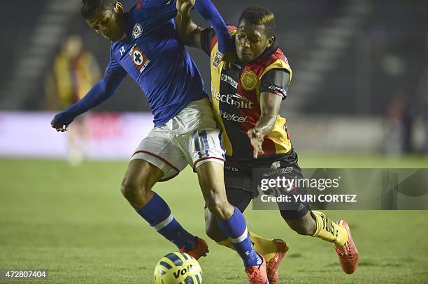 Leones Negros's forward Jonathan Gonzalez vies for the ball with Cruz Azul's midfielder Joao Rojas during their Clausura tournament football match at...