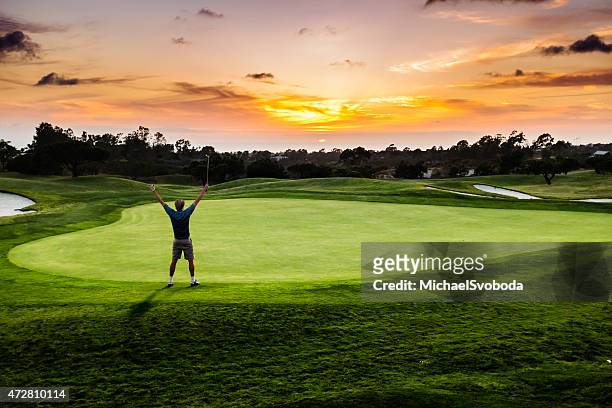 sunset putter celebration - golfer stock pictures, royalty-free photos & images