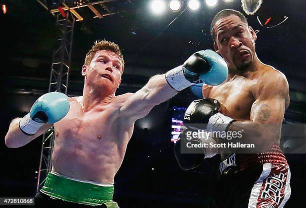 Canelo Alvarez of Mexico delivers a punch to James Kirkland during their super welterweight bout at Minute Maid Park on May 9, 2015 in Houston, Texas.
